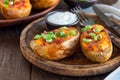 Baked loaded potato skins with cheddar cheese and bacon, garnish Royalty Free Stock Photo