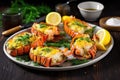 baked lobster tails with gold spoon slicing through herb butter