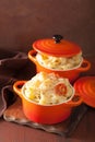 Baked macaroni with cheese in orange casserole Royalty Free Stock Photo