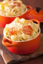 Baked macaroni with cheese in orange casserole Royalty Free Stock Photo