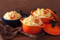 Baked macaroni with cheese in orange casserole Royalty Free Stock Photo