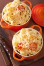 Baked macaroni with cheese in orange casserole Royalty Free Stock Photo