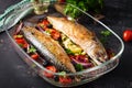 Baked mackerel with herbs and lemon and vegetables. Healthy dinnerBaked mackerel with herbs and lemon and vegetables. Royalty Free Stock Photo