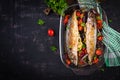 Baked mackerel with herbs and lemon and vegetables. Healthy dinner. Royalty Free Stock Photo