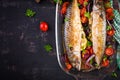 Baked mackerel with herbs and lemon and  vegetables. Healthy dinner. Royalty Free Stock Photo