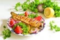 Baked mackerel with lemon, onion, herbs Royalty Free Stock Photo