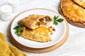 Baked meat turnovers or pies, or empanadas, or cornish pasty with filling, beef