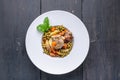 Baked meat with vegetables. Potatoes, carrots, green peas and turkey meat on a white plate Top view Royalty Free Stock Photo