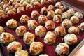 Baked meatballs on a red silicon mat