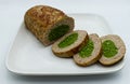 Baked meatloaf with spinach isolated on white background Royalty Free Stock Photo