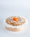 Baked mini crumble cake with dried fruits on recycle Mini Wooden Baking Mold, white background, copy space, selective focus.