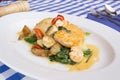 Baked monkfish with vegetables. Traditional recipe from the north of Spain. Royalty Free Stock Photo