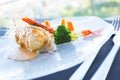 Baked monkfish with vegetables. Traditional recipe from the north of Spain. Royalty Free Stock Photo