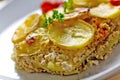 Baked moussaka dish on a wooden board