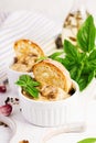 Baked mushroom julienne with chicken, cheese and toast in potsBaked mushroom julienne with chicken, cheese and toast