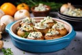 baked mushrooms stuffed with creamy blue cheese in a ceramic dish