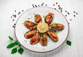 Baked mussels with cheese on plate Royalty Free Stock Photo