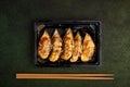 Baked Mussels With Cheese And Sesame Seeds In Shells On A Dark Green Textured Background, Top View, Seafood