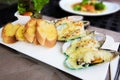 Baked mussels with cheese and toasts Royalty Free Stock Photo