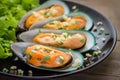 Baked mussels with garlic on plate