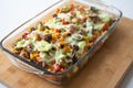 Baked nachos with corn tortilla chips, corn, guacamole, pico de gallo, beans, jalapenos and Monterrey jack Royalty Free Stock Photo