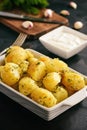 Baked new potatoes with garlic and dill. Royalty Free Stock Photo