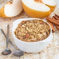 Baked oatmeal with nuts, almond milk, honey, spices and pear, square Royalty Free Stock Photo