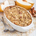 Baked oatmeal with nuts, almond milk, honey, spices and asian pear, square Royalty Free Stock Photo