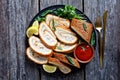 Baked Omelet Roll on a black plate Royalty Free Stock Photo