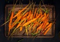 Baked organic carrots with thyme, honey and lemon. Organic vegan food.