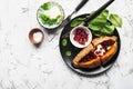 Baked in the oven sweet potatoes with butter, salt, cilantro and pomegranate seeds on a plate with a garnish of fresh Royalty Free Stock Photo