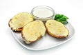 Baked oysters with cheese and sauce on a plate on a white background Royalty Free Stock Photo
