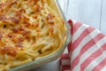 Baked pasta on wooden table