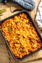 Baked pasta with smoked meat, sausage, egg, cheese and spices. Traditional Czech food Royalty Free Stock Photo