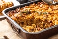 Baked pasta with smoked meat, sausage, egg, cheese and spices. Traditional Czech food Royalty Free Stock Photo