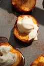 Baked peaches with cinnamon and ice cream