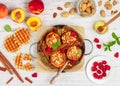 Baked peaches with ricotta, almonds, biscuit crumbs or Viennese Belgian waffles and cinnamon, served with honey, raspberries Royalty Free Stock Photo