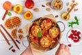 Baked peaches with ricotta, almonds, biscuit crumbs or Viennese Belgian waffles and cinnamon, served with honey, raspberries Royalty Free Stock Photo