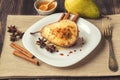 Baked pear with ricotta cheese, honey and cinnamon