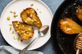 Baked pears with honey served with chopped pistachio