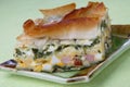 Baked pie with ham, spinach and boiled eggs