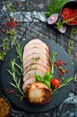 Baked piece of pork with rosemary. Top view.