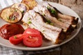 Baked pork brisket with potatoes and sauce close up. horizontal Royalty Free Stock Photo