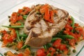 Baked pork meat with tomato, green beans and capers