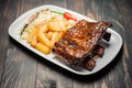Baked pork ribs glazed in soy sauce and honey, close-up Royalty Free Stock Photo