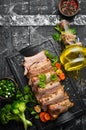 Baked pork ribs with mustard and spices on a black stone plate. Top view. Royalty Free Stock Photo