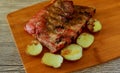 Baked pork ribs with potatoes on a wooden tray Royalty Free Stock Photo