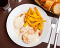 baked pork tenderloin al Roquefort with cheese sauce, served with potatoes