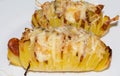 Baked potato with bacon, sausage, onion and cheese