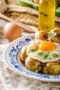 Baked potato with chili and fried egg Royalty Free Stock Photo